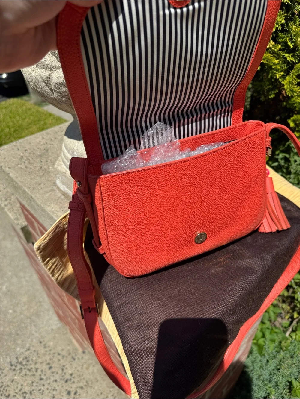 kate spade coral orange pebbled leather crossbody with tassels